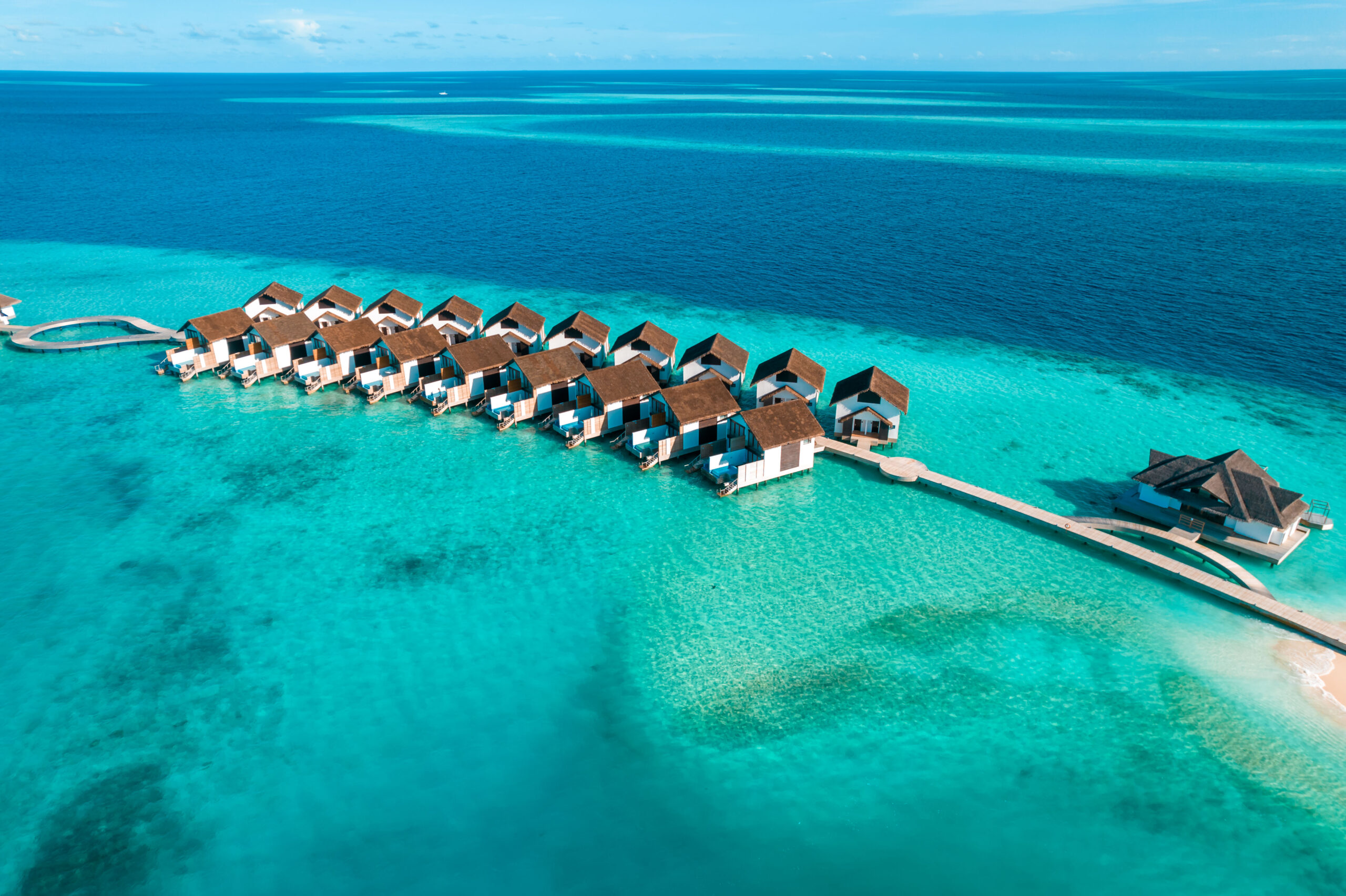 An overwater jetty reaching into a lagoon