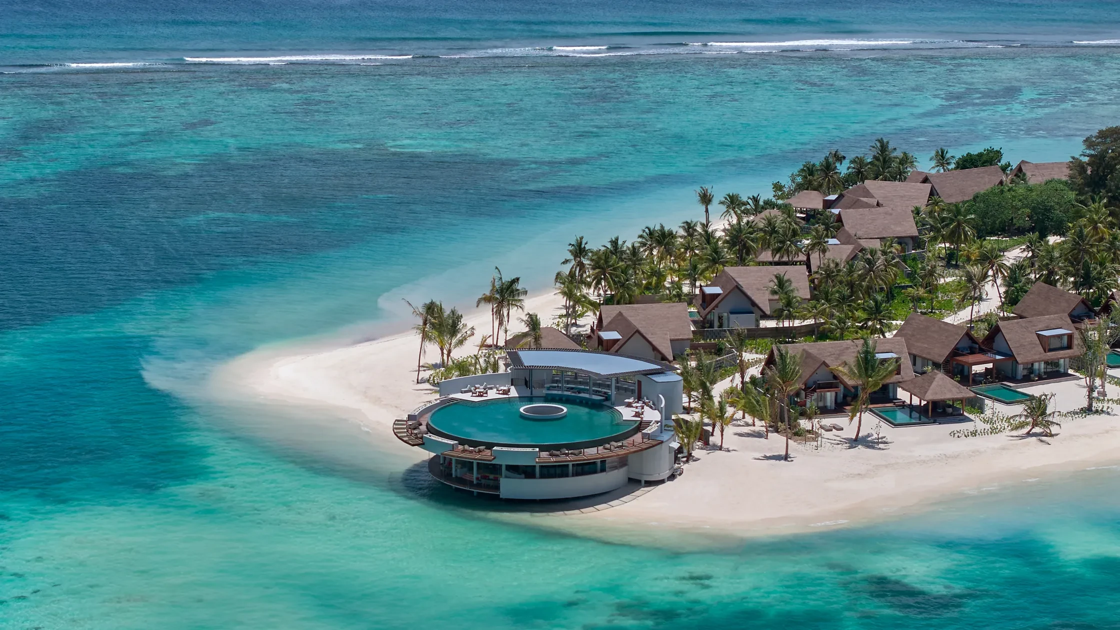 An island beach and its reef, above and below the waterline
